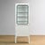 Vintage medicine cabinet from the 1970s, produced in Hungary. This cabinet is made of iron and glass, with the glass held...