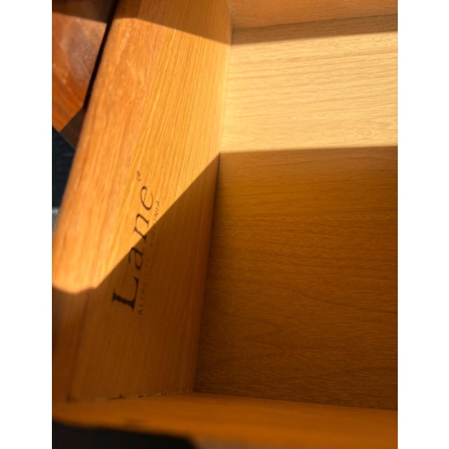 Perfect example of mid century design - walnut, clean lines, sculpted pulls and tapered legs. A solid nightstand from...