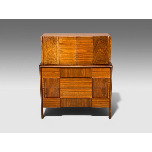 Edmund Spence, Swedish Mid-Century Modern, Sculptural Highboy, Walnut, Sweden, 1950s A rare sculptural highboy dresser...