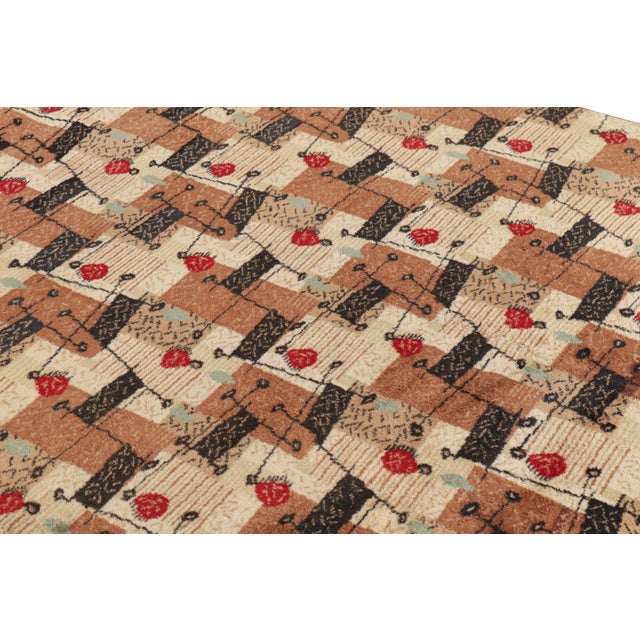Hand-knotted in wool, this 5x8 vintage rug originating from Turkey, circa 1960-1970, is a very special piece, featuring a...