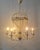 Chandelier in the shape of a hot air balloon, mid-20th century. A whimsical structure with arched metal rods forming an...