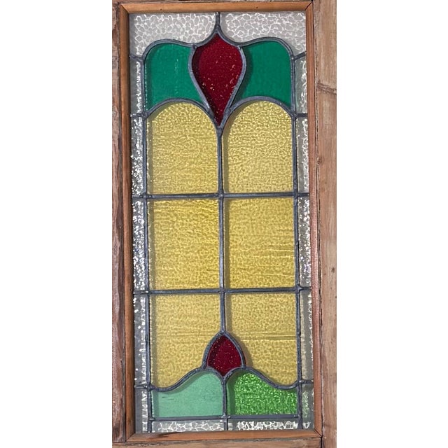English stained glass door with three refinished stained glass pieces. (Circa. late 1800s) Dimensions: 28 W x 79 H