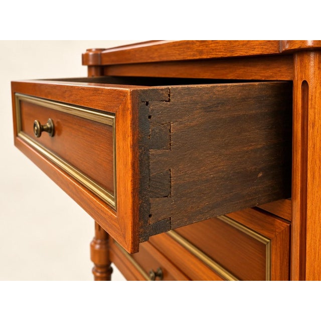Pair of louis xvi style bedside tables in solid mahogany with brass stringing. Circa 1970. each table features three...