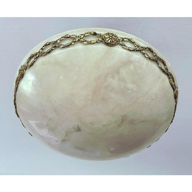 Exceptionnal Art Deco pendant light with smoke / flamme swirls pattern alabaster marble shade with an ormulu bronze...