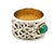 Vintage statement ring crafted in 14 karat white gold and centered with a natural emerald cabochon measuring approximately...