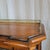 This Walnut Glazed Door Bookcase With Fluted Pilasters With Brass Gallery Top is a pretty accent piece that is perfect for...