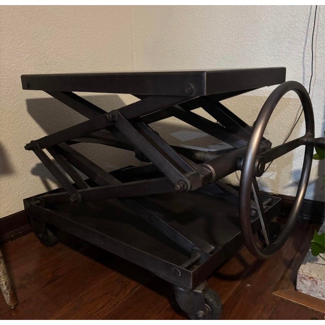 RH has reproduced and repurposed an early 20th-century American factory jack as a bold, industrial table with uncommon...