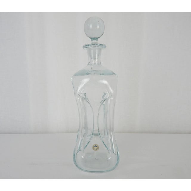 Elegant 1960s 'Kluk Kluk' decanter as designed by Jacob Eiler Bang for Holmegaard. Original label intact reads, 'Kastrup...