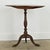 A Swedish 19th century round tilt top table with a charming faux bois, grain-painted finish to appear as mahogany or other...