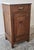 A charming and authentic 1930s French oak nightstand featuring elegant Art Deco styling, rich oak grain, and a beautiful...