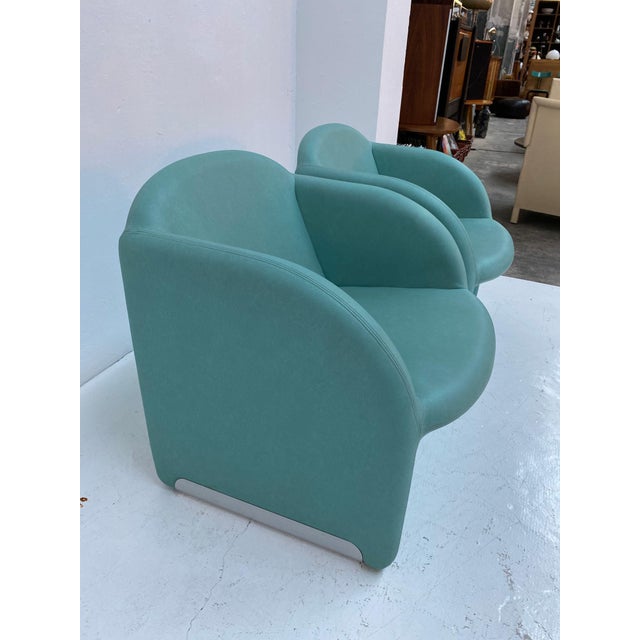 Clean and slim-lined 1980s club chairs, upholstered in turquoise vinyl. Very similiar to the "Ben chair" by Pierre Paulin,...