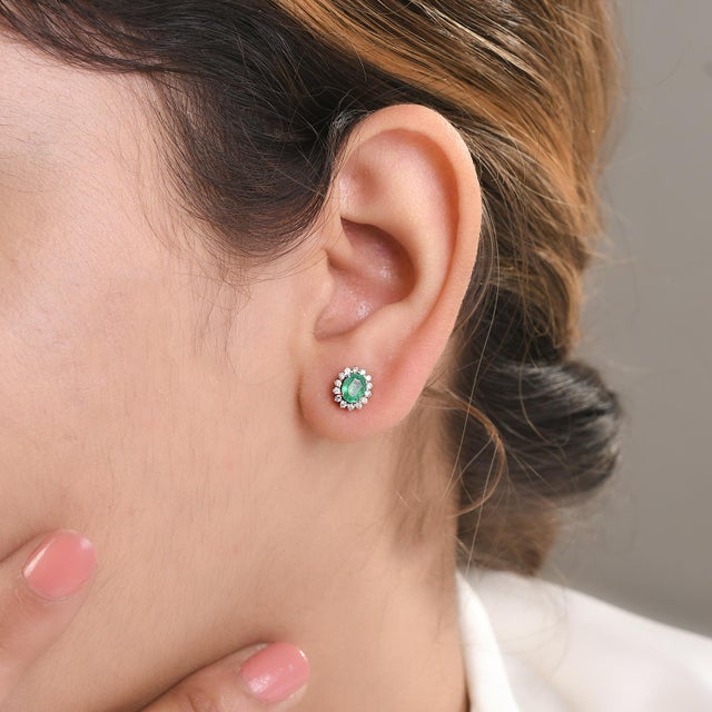 Dainty Diamond Emerald Stud Earrings in 14K Gold to make a statement with your look. You shall need stud earrings to make...