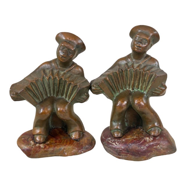 1920s Hubley Cast Iron Accordion Player Bookends on Banded Onyx - Pair For Sale