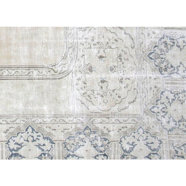 1960s Persian Kerman Rug. Hand woven in the Kerman region of Iran. Distressed and refinished in the U.S. The Persian...