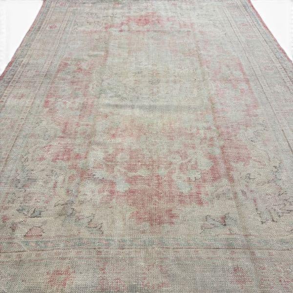 This antique Turkish Gördes rug is a beautiful example of how age can transform a traditional design into something...