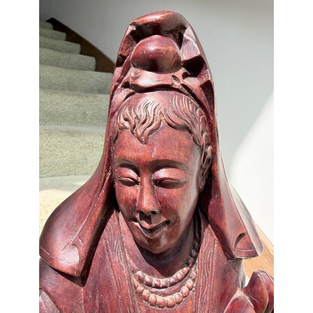 This is a Vintage Chinese 24.5” tall Rosewood Kuan Yin (Bodhisattva, goddess of compassion) figurine. Circa 1940, she is...