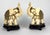 A pair of Mid 20th Century intricately carved Chinese bone elephants, decorated with tooled metalwork, and turquoise and...