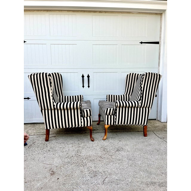 A chic pair of vintage wingbacks that have been recently recovered in a black and white stripe grosgrain style fabric....