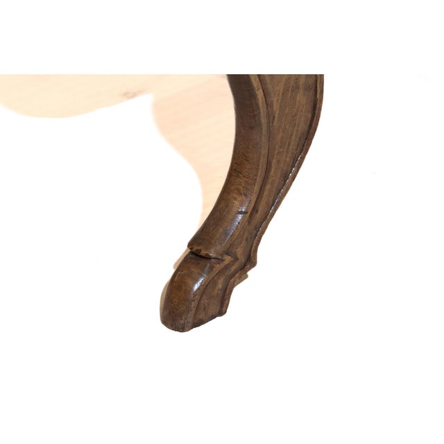 With rectangular seat inset with handcaned panel; the paneled seat rail raised on stylized cabriole legs terminating in...