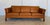 Made in Denmark by Morgans Hansen, this is a beautiful vintage Danish classic 3 person sofa upholstered in soft Cognac...