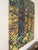 This artwork captures the essence of autumn through a vibrant depiction of a mother tree surrounded by a rich tapestry of...