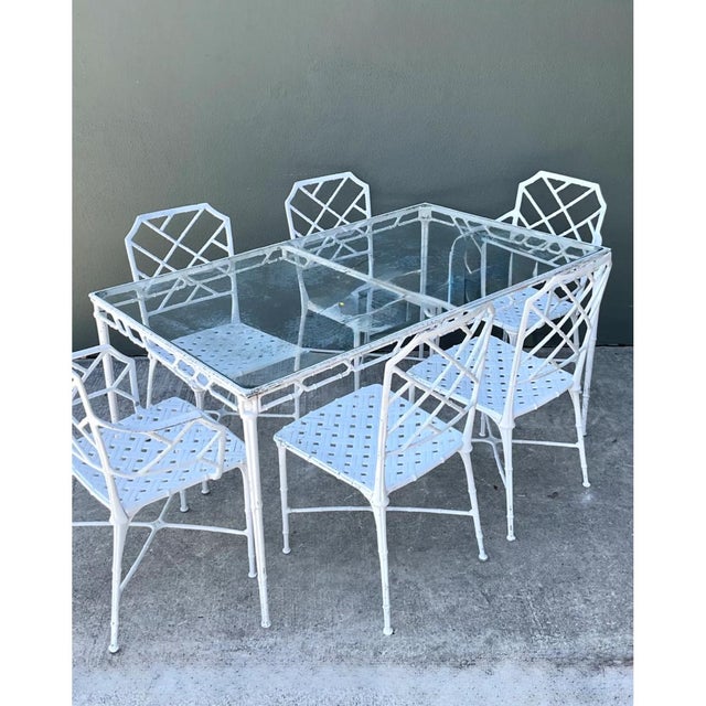 Exemplifying the height of mid-century resort luxury, this authentic vintage "Calcutta" dining table by Brown Jordan...
