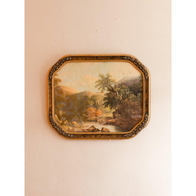 Color print of a romantic river landscape with figures on the rocky bank, sheep beyond and wooded hills under a hazy sky....
