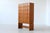 Striking Mid-Century highboard, crafted from warm oak and showcases a bold Brutalist aesthetic, produced in Germany around...