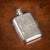 A stunning early 20th Century Chinese Export solid silver hip flask with silver hinged top and removable cup. This flask...