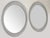 Pair of Decorative Large Hollywood Regency Style Oval Wall Mirrors. Each mirror has a decorative plastic frame made up of...