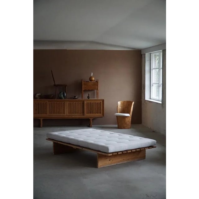 A large Danish mid century daybed in solid pine, reupholstered in grey wool. Made by a Danish company "Nyt i Bo" in 1970s....