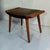 Elegant Danish Mid-Century Modern stool dating from the 1960s, crafted in teak and featuring a distinctive sculptural...