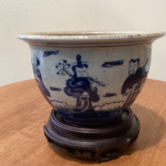 This Antique Chinese Kangxi Style Blue White Glazed Jardiniere is a beautiful piece from the Qing Dynasty, featuring...