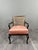 Pair of stained wood armchairs, resting on cabriole legs ending in deer feet. The caned backs, in good condition, lend...