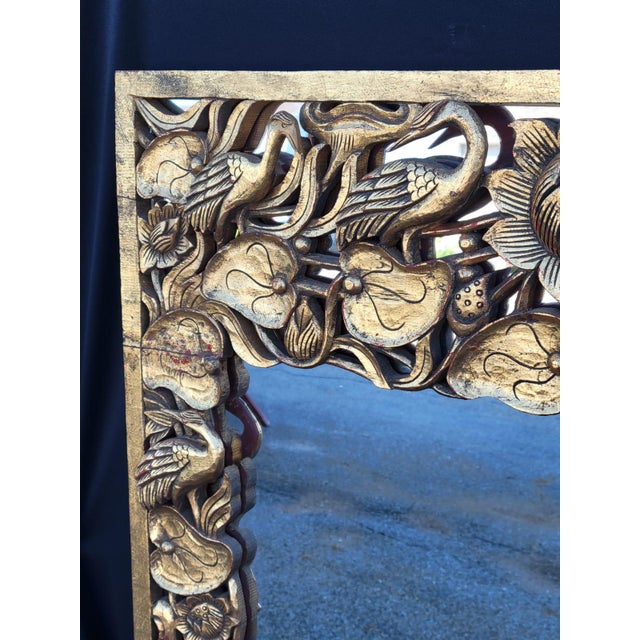 The product is a vintage 1950 Hollywood-style Chinese mirror with intricate bird carvings on the frame. Made of glass with...