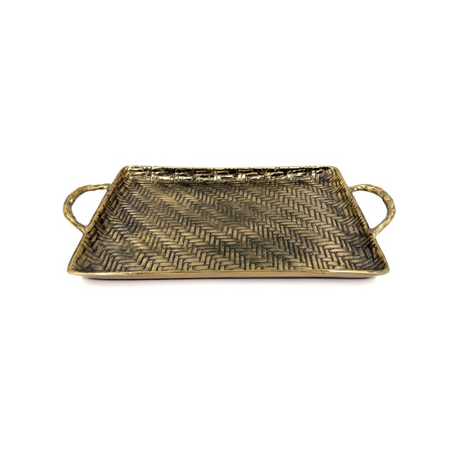 Handcrafter in India, this substantial and sculptural decorative serving tray features a deeply textured herringbone...