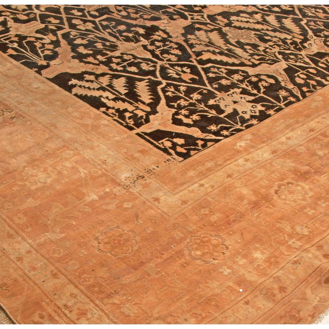 This magnificent antique Agra rug from the 1880s is a breathtaking example of Indian textile artistry, created during the...