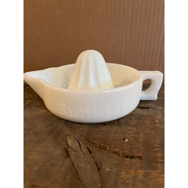 Vintage Milk Glass Sunkist Juicer. In excellent vintage condition.