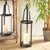 Traditional in form with a tall & narrow profile, this hurricane is at home in a casual space. With a clever hinged...