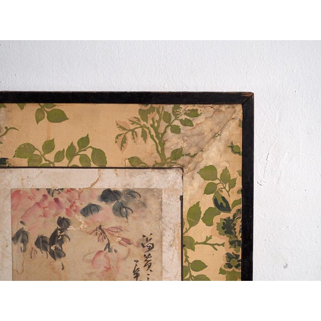 This antique japanese two-panel screen is a byōbu in harimaze mounting, with pasted paintings and calligraphy on the...