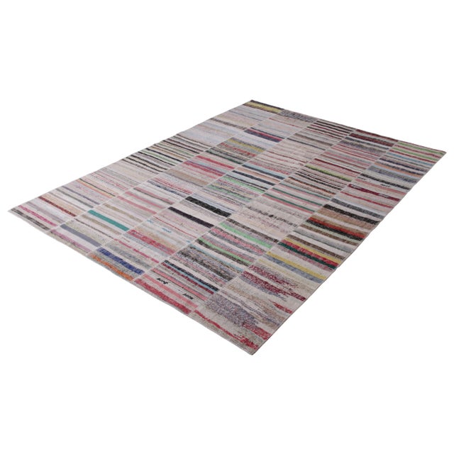 Handwoven in a wool flatweave utilizing vintage yarns, this modern Kilim rug from Rug & Kilim’s Patchwork Kilim rug...