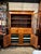A two-piece design, with the top section sitting back from the base to create a counter space. These cupboards were...