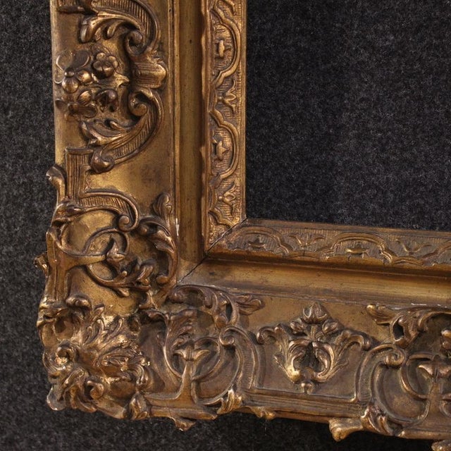 Mid-20th-century Italian frame. Crafted from wood and gesso, this piece features intricate carving and chasing with a...