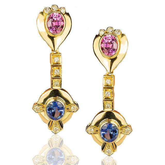 18K Earrings with 2 pink and 2 blue sapphires weighing 2.93 carats and 18 round brilliant diamonds weighing 0.27 carats...