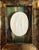 A charming, petite framed grand tour style intaglio. Features a white plaster intaglio of the Three Graces mounted on a...