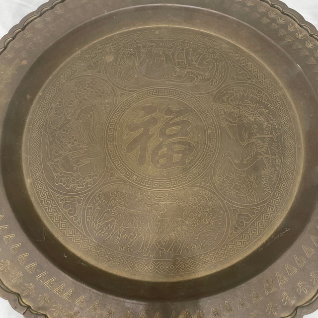 This vintage etched brass fortune tray is meant to offer up fortune, happiness or luck to its owner. With its dark patina...