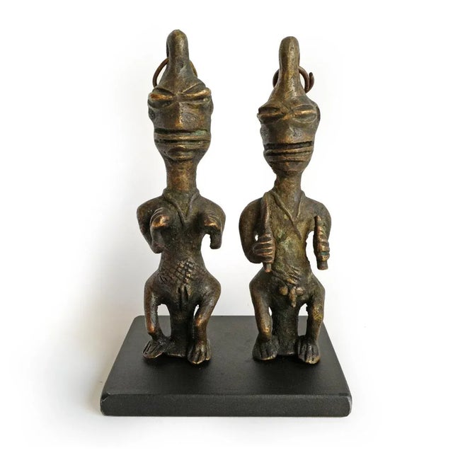 Original Edan Yoruba divination bronze figures mounted on removable iron display base. This pair of male and female...