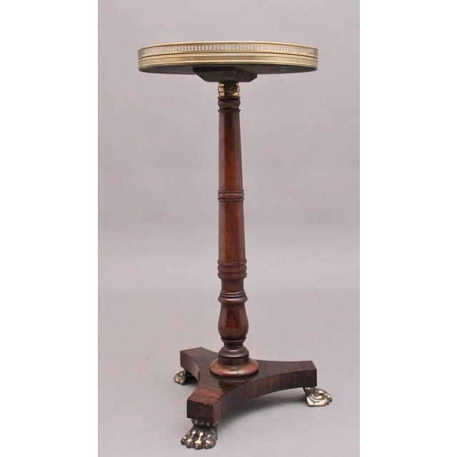 Early 19th Century Regency rosewood telescopic occasional table, having a lovely figured circular top with a pierced brass...