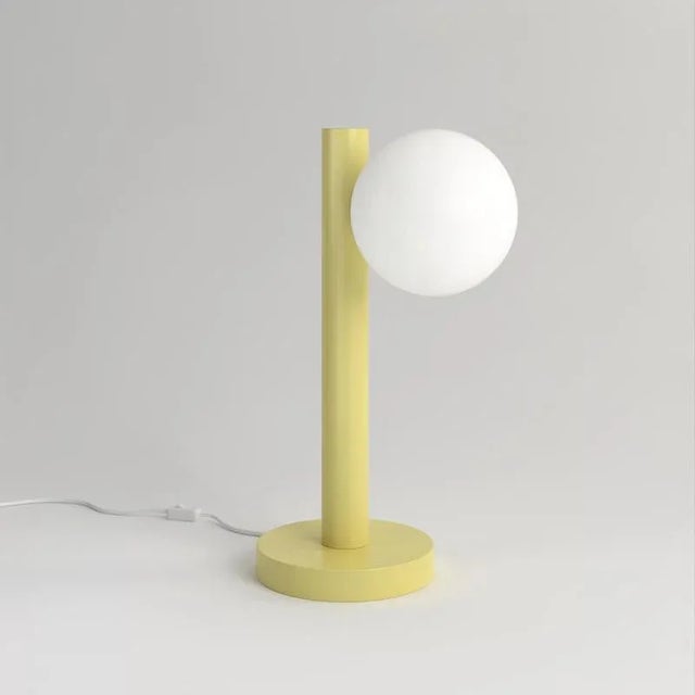 Yellow tube with globes and cones desk light, globe, by atelier areti dimensions: d 23.5 x h 37.5 cm. Materials: powder-...