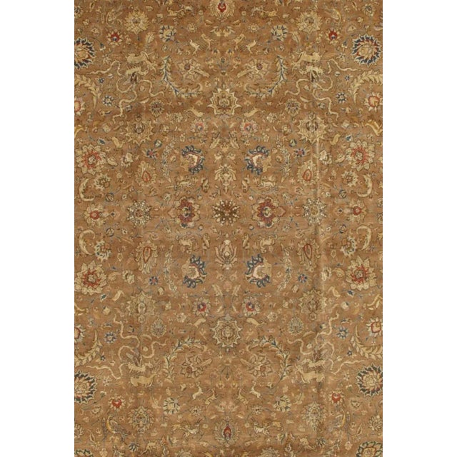 This One-of-a-Kind Tabriz Hand-Knotted Wool Brown Area Rug recreates the majesty of a timeless classic, updated with a...